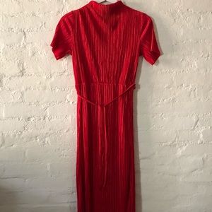 Pleated dress with tie & high neckline